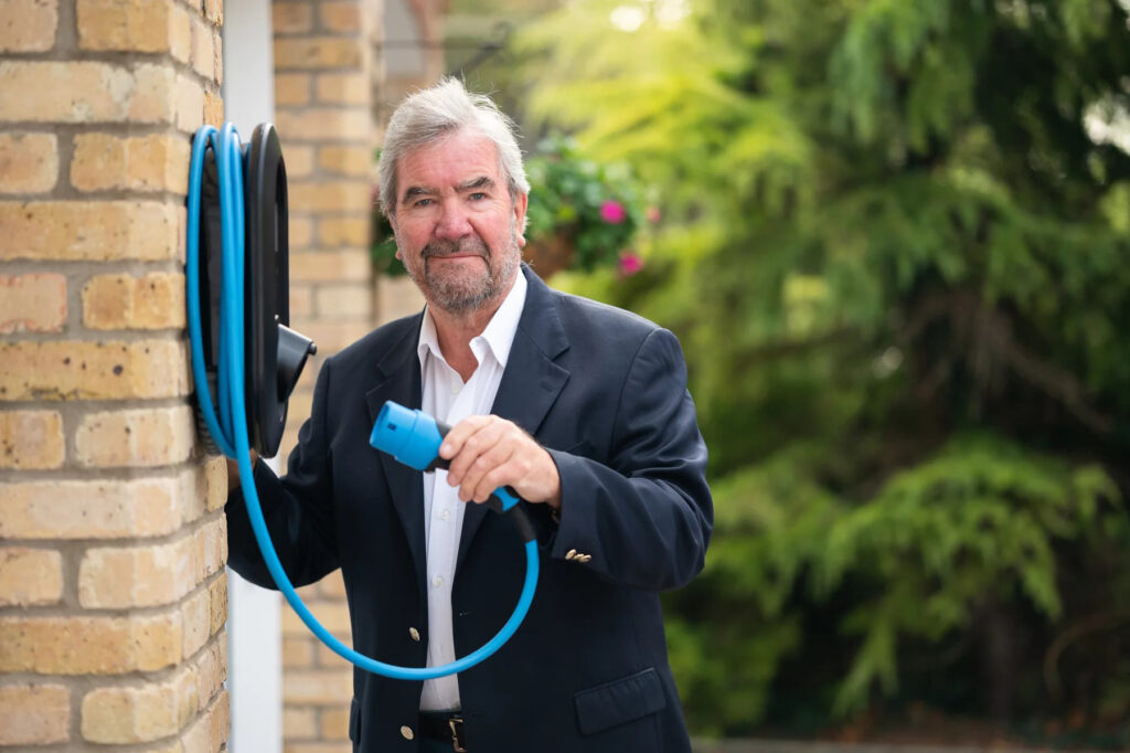 EVIOS founder David Martell and the company's first chargepoint. Image: EVIOS.