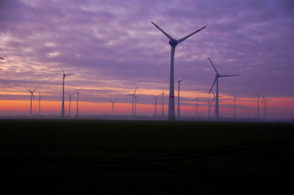 Wind turbines at night.