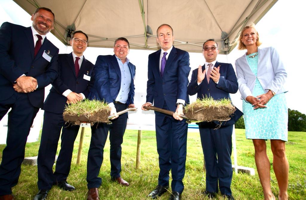 Irish Taoiseach Micheal Martin joins in with the ceremonial start of construction.