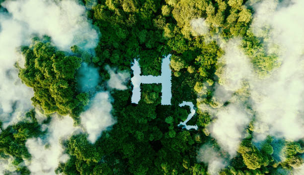 Image of chemical symbol for Hydrogen viewed from above among trees and cloud