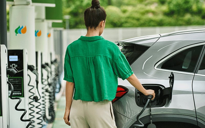 Woman Charging EV Scottish Power