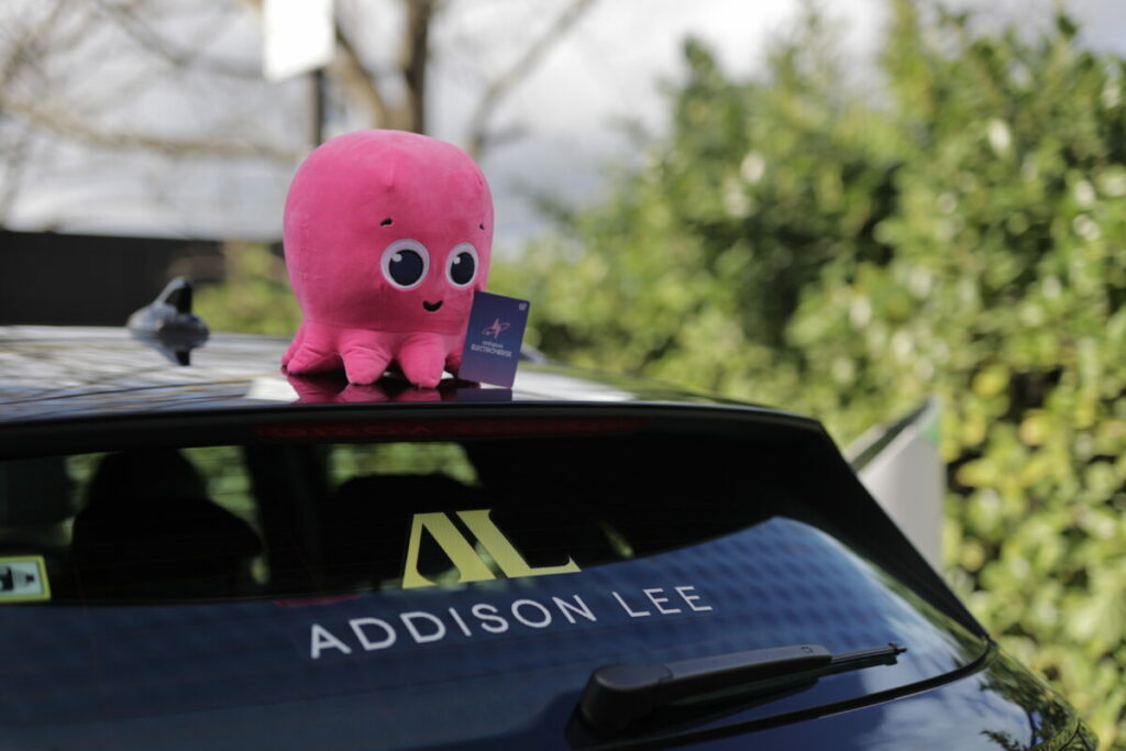 Image of Addison Lee taxi with pink octopus plus toy on roof