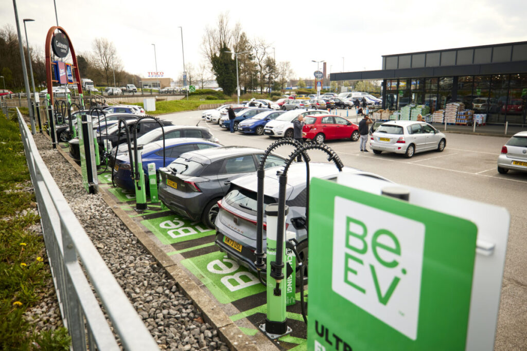 Cars lined up at a Be.EV branded charger