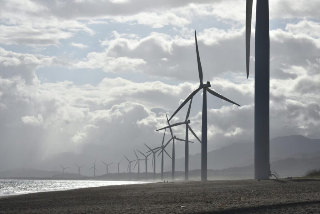 image of wind turbines against a cloudy sky