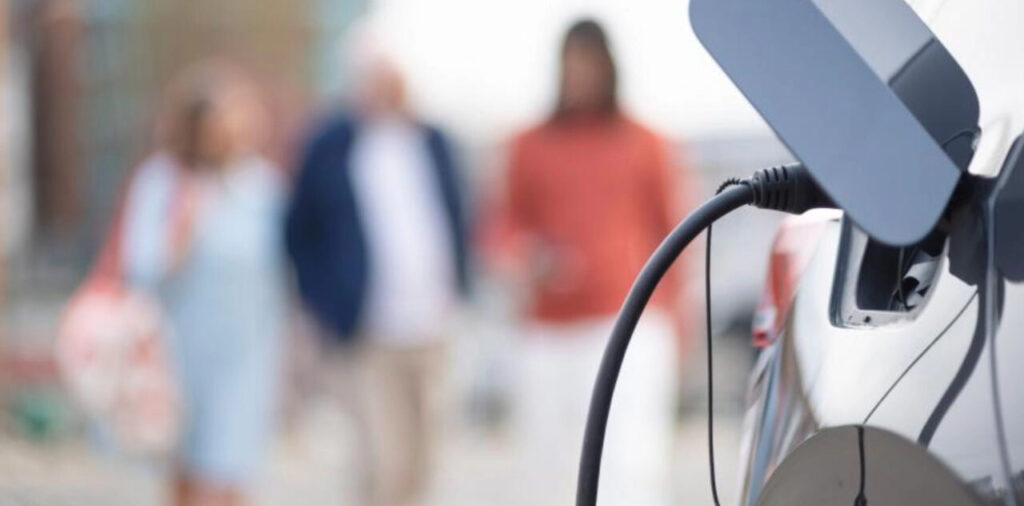 A close up of an EV plugged into a chargepoint
