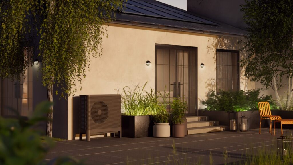 The outside of a modern house at dusk with many potted plants and a heat pump outside