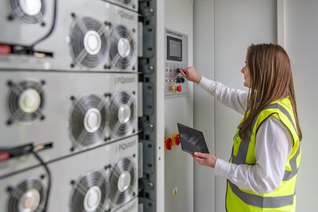 A woman and an energy storage system.