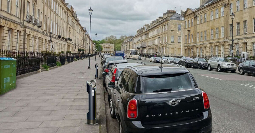 Street with car parking and EV chargers.