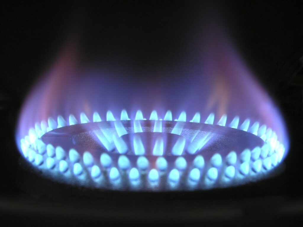 a close up of blue gas flames