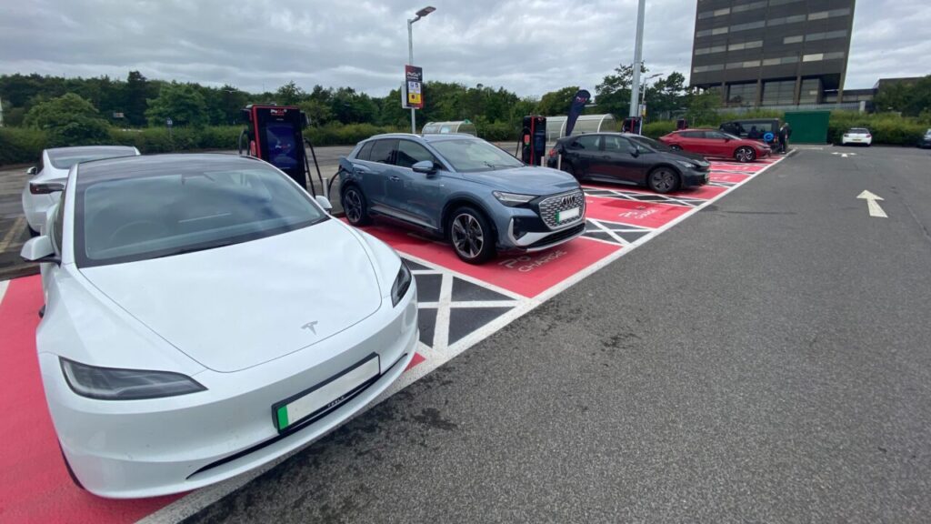 electric cars in a car park lined up