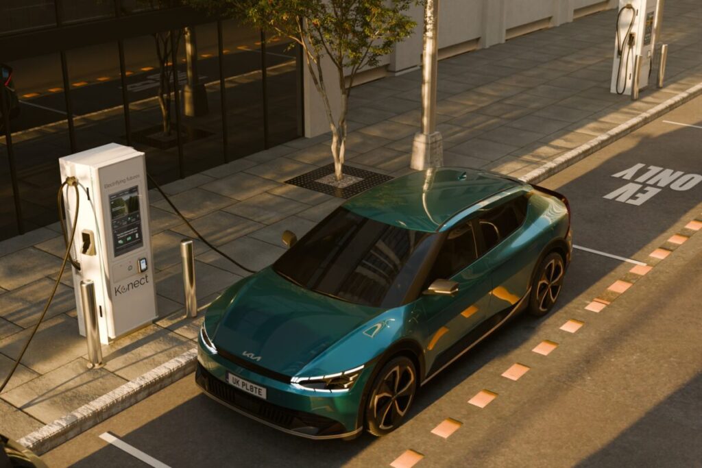 a 3d render of an EV plugged into a public chargepoint on the road