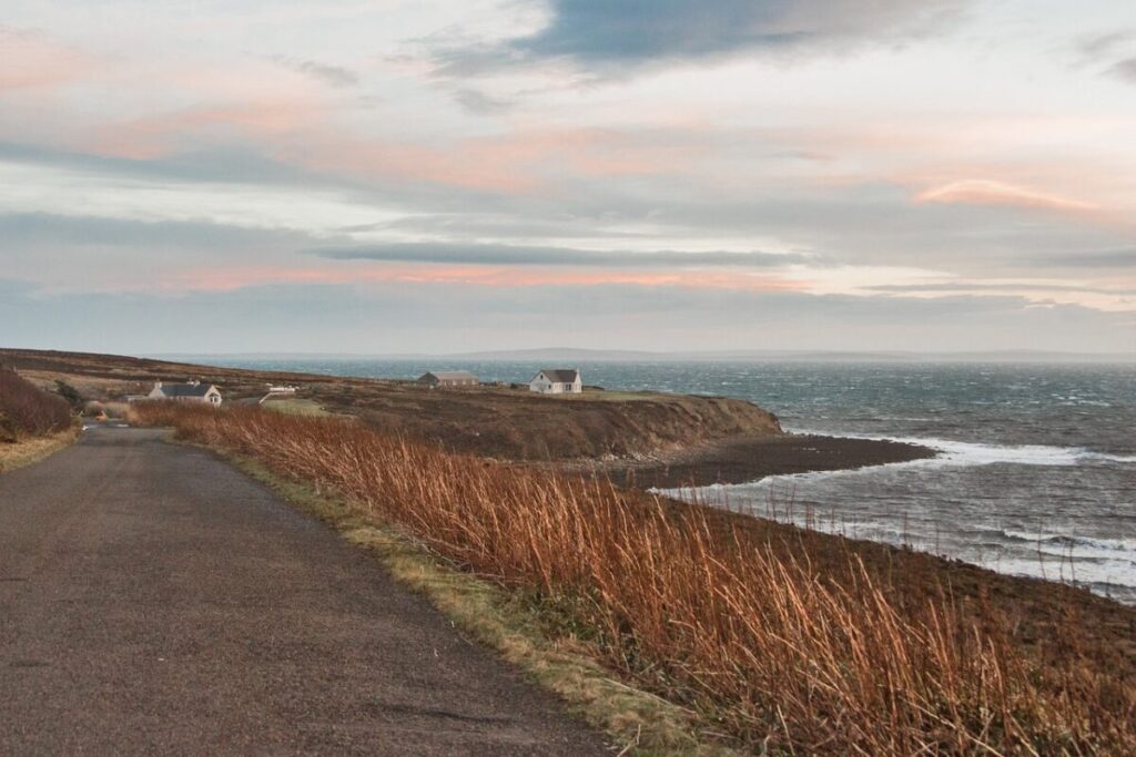 A windswept scottish island at sunset