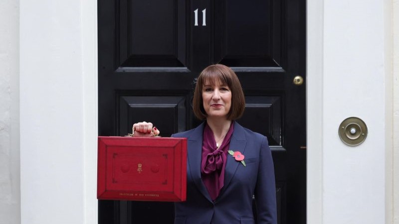 Rachel Reeves holds the red briefcase outside 11 downing street