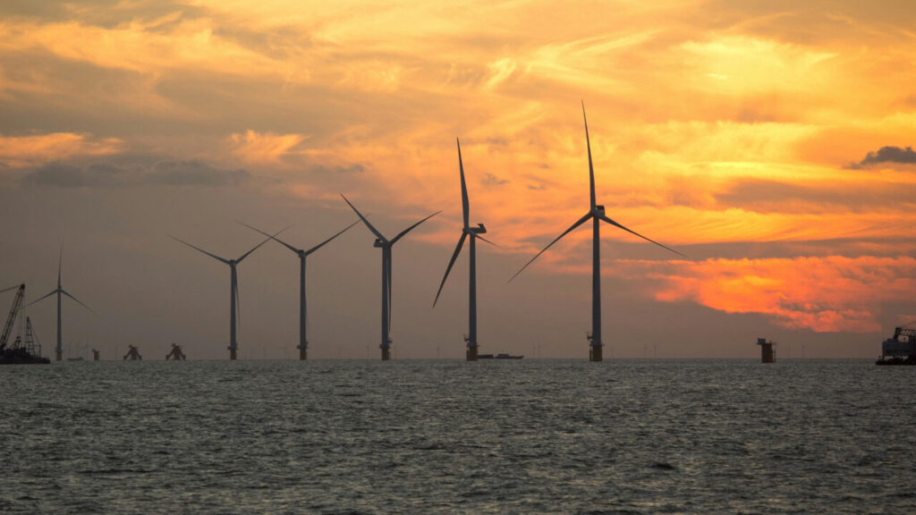 Offshore wind turbines at sunset