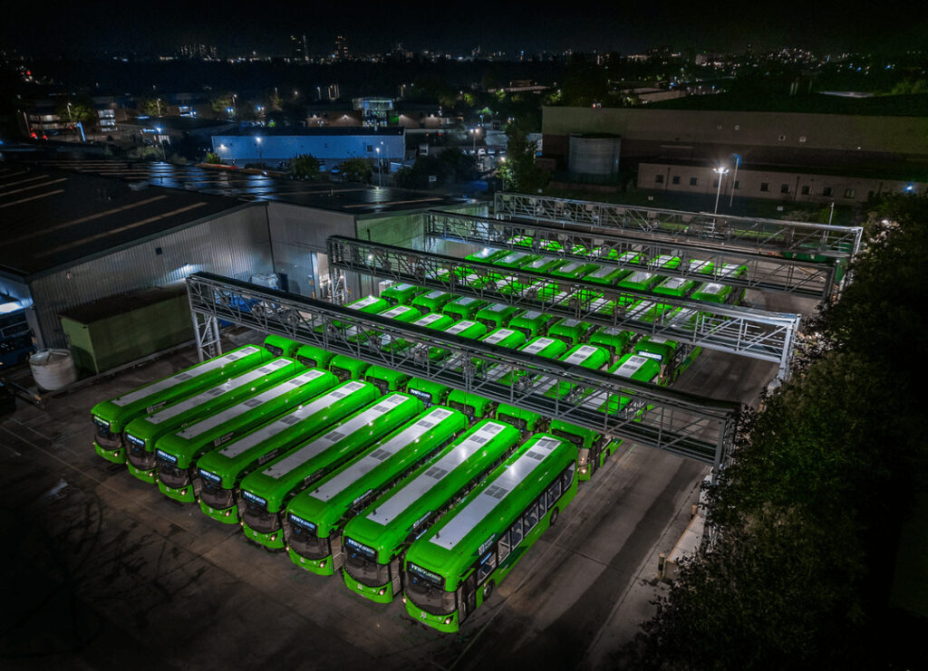 An overhead shot of a bus depot at night