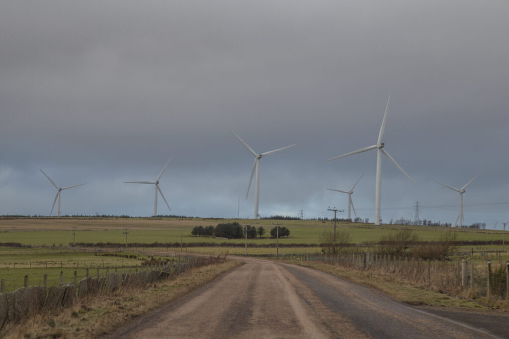 Wind turbines and grid lines in Scotland.