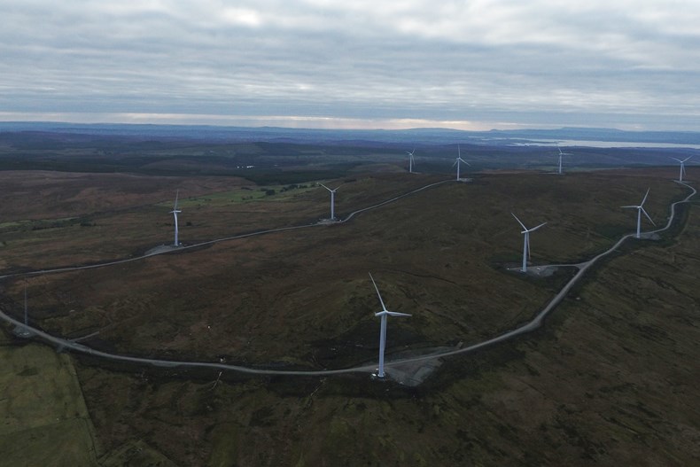 an overhead shot of an onshore wind farm