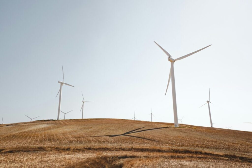 Wind turbines on a dusty hill