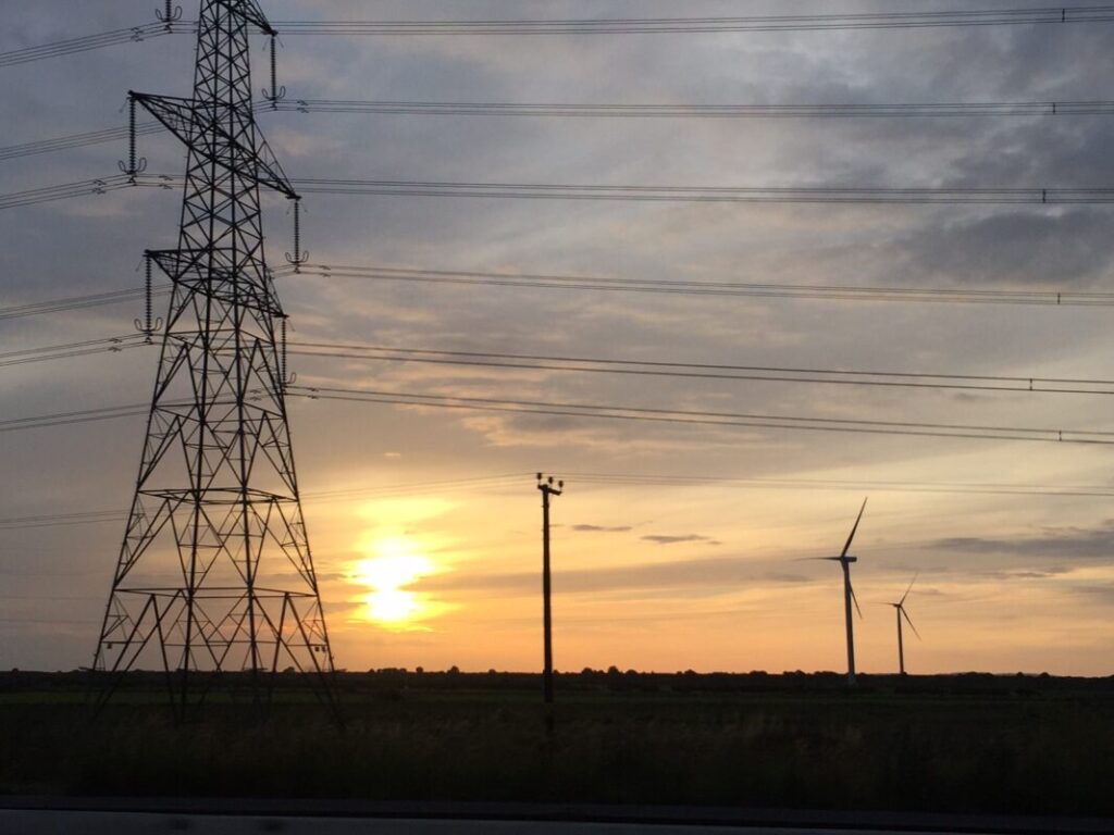 a pylon in silhouette at sunset