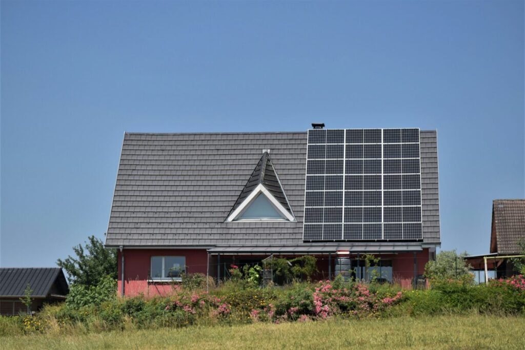 a single house with solar panels on the roof