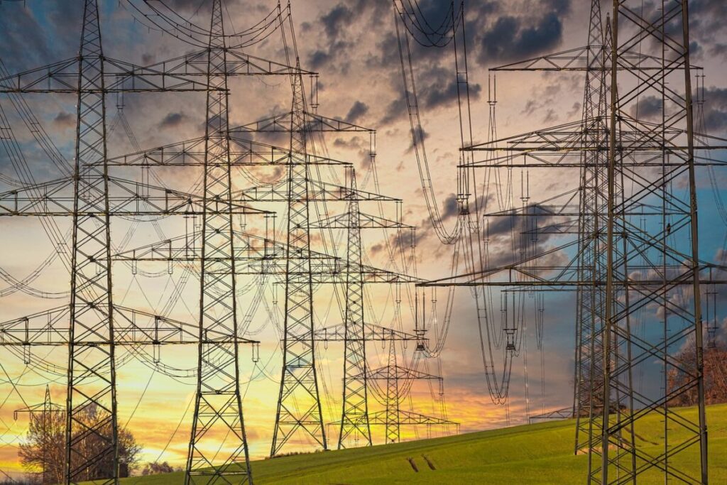 transmission towers at sunset