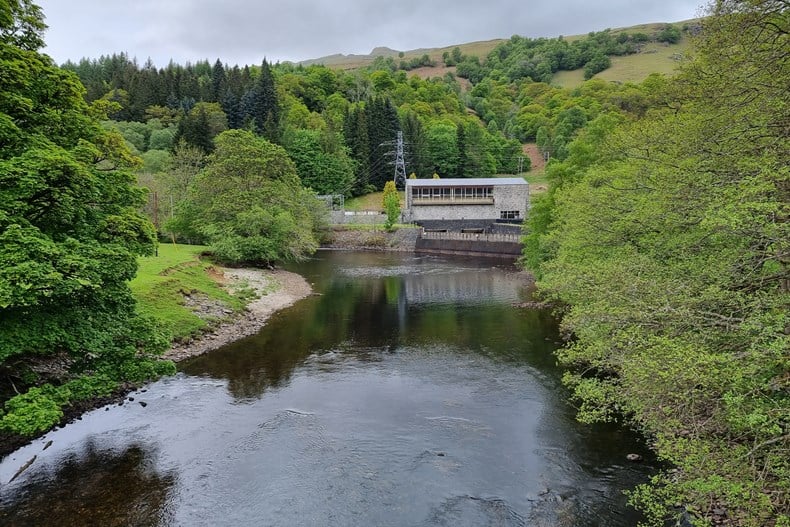 Lochay hydro power station in the background above a large body of water