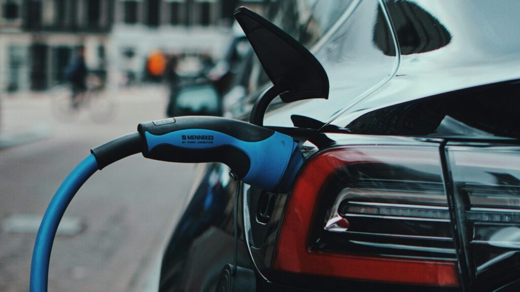 close up of an ev charger plugged into a car