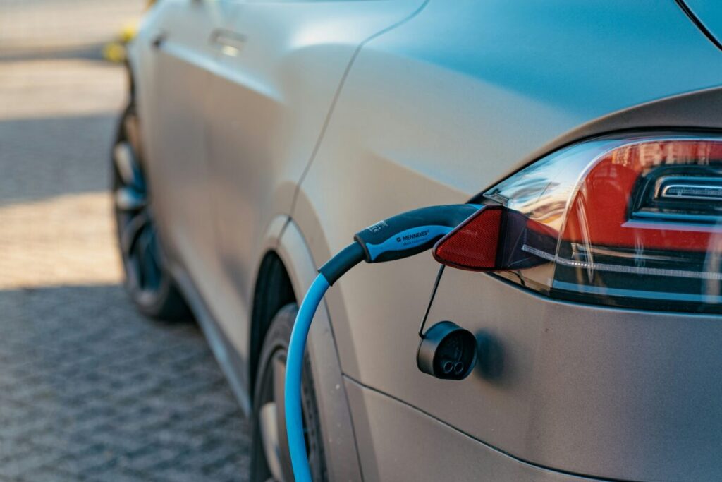 a charger plugged into an EV