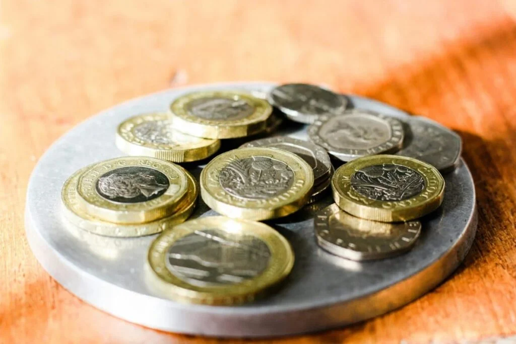 a pile of £1 coins on a plate