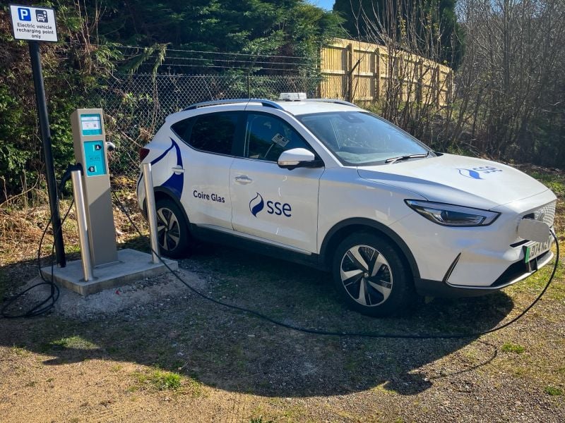 an sse branded car plugged into a charger