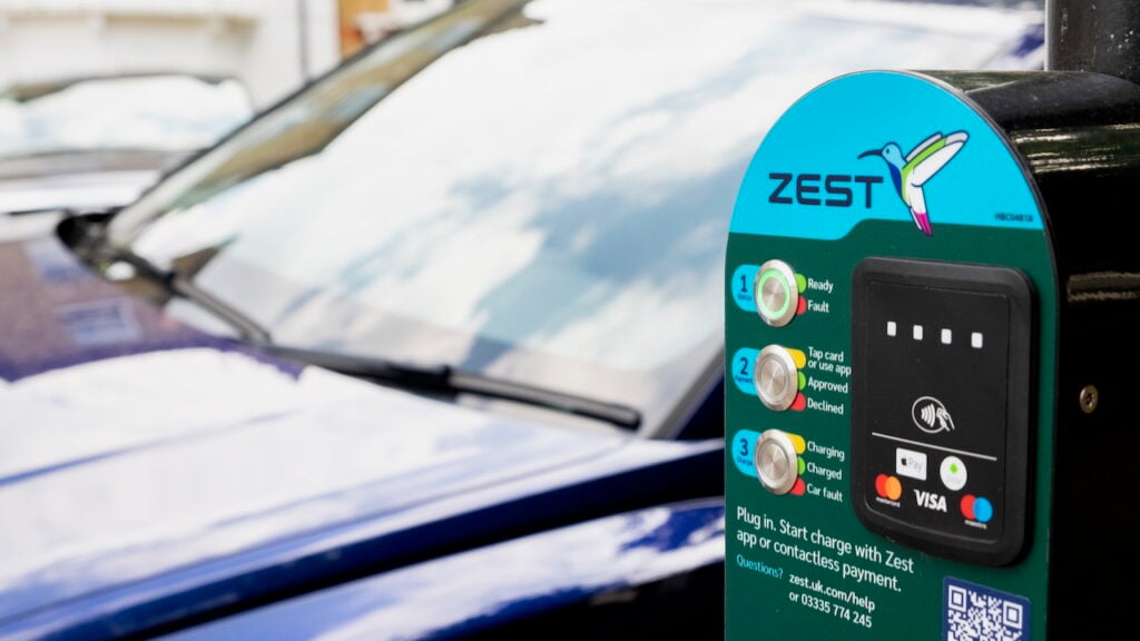 a car next to a Zest EV charger