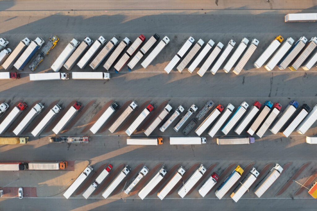 a birds-eye view of a series of parked trucks