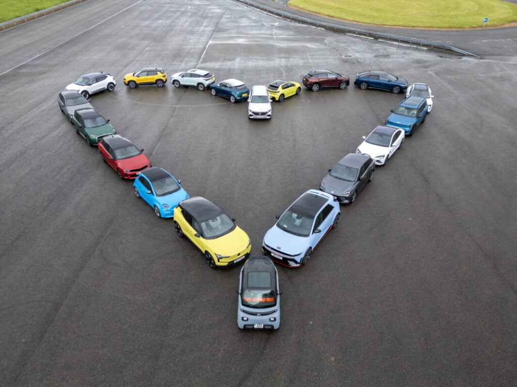a number of different BEV cars parked in a heart shape