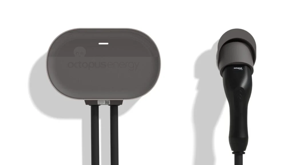 a white wall with a black EV charger on it