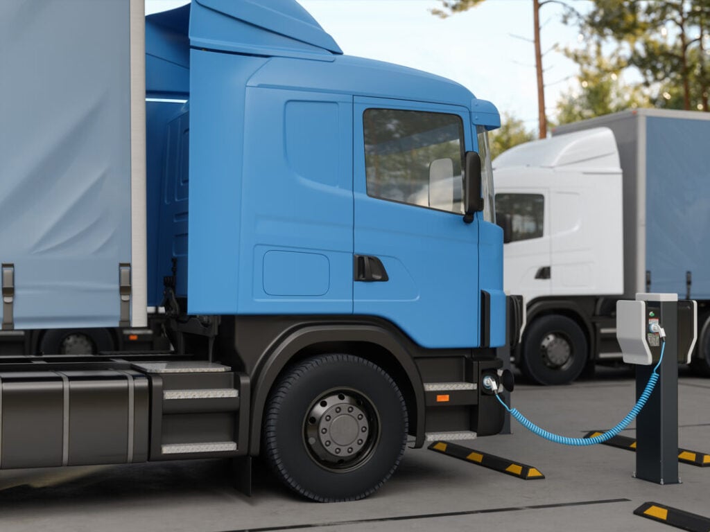 a truck plugged into a charger