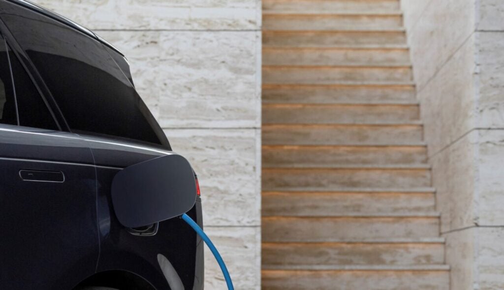a close up of an ev plugged into a charger