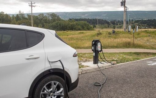 A white vehicle charges at the St. Mary Visitor Center