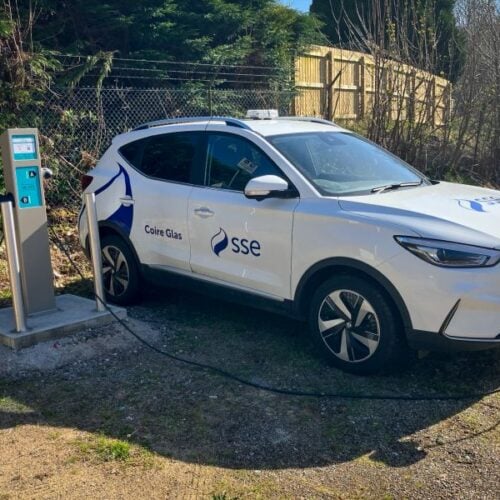 an sse branded car plugged into a charger