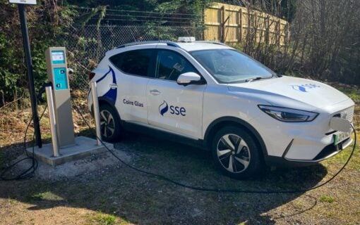 an sse branded car plugged into a charger