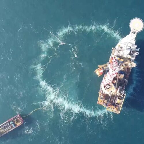 a ring of bubbles around a wind turbine from a top down view