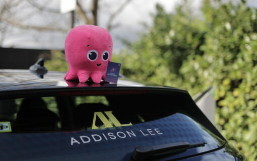 Image of Addison Lee taxi with pink octopus plus toy on roof