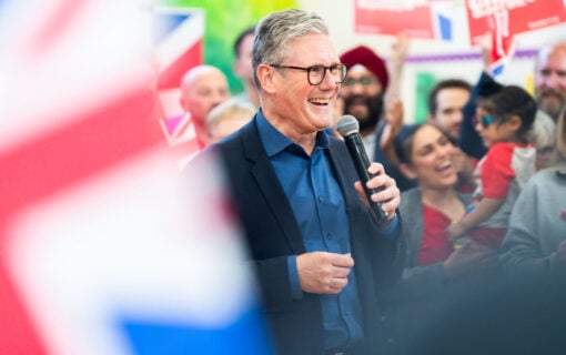 Keir Starmer smiling in a crowd on his election campaign.