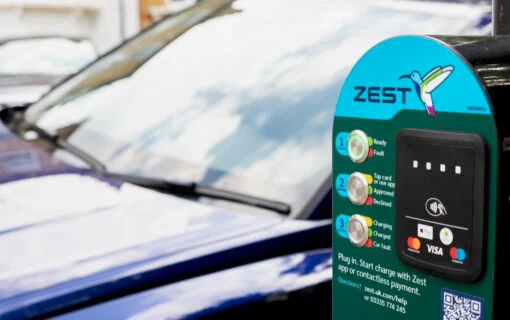 a car next to a Zest EV charger