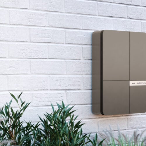 a steel ev charger box on an external wall