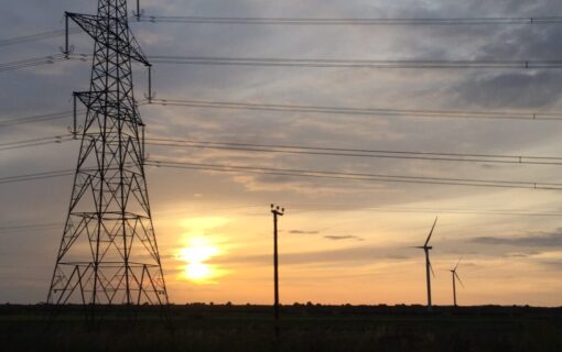 a pylon in silhouette at sunset