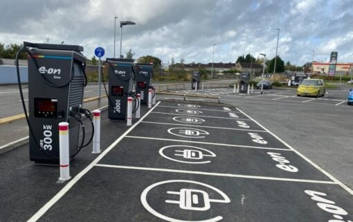 EV chargers in a row, with the e.on logo on the ground in front of each