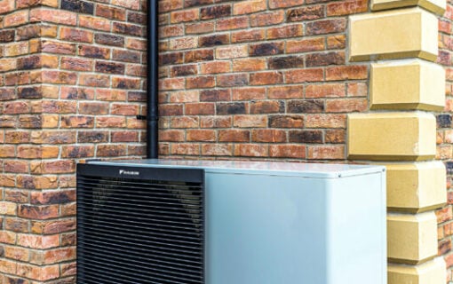 EDF Heat Pump mounted against a brick wall