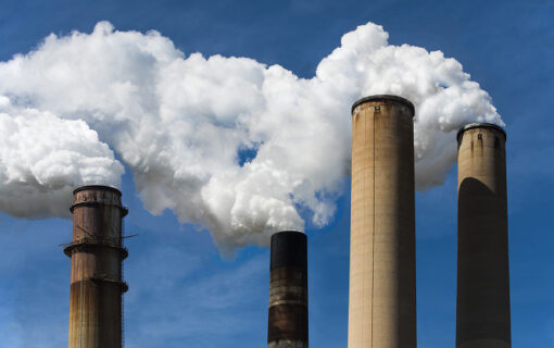 smokestacks pouring out white smoke