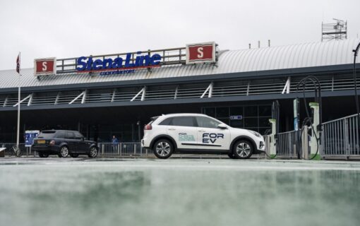 An EV with the FOR EV logo sits in front of a Stena Line port in the rain
