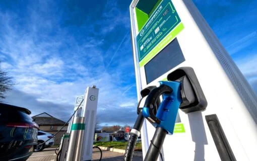 a close up from a low angle of a gridserve EV charger
